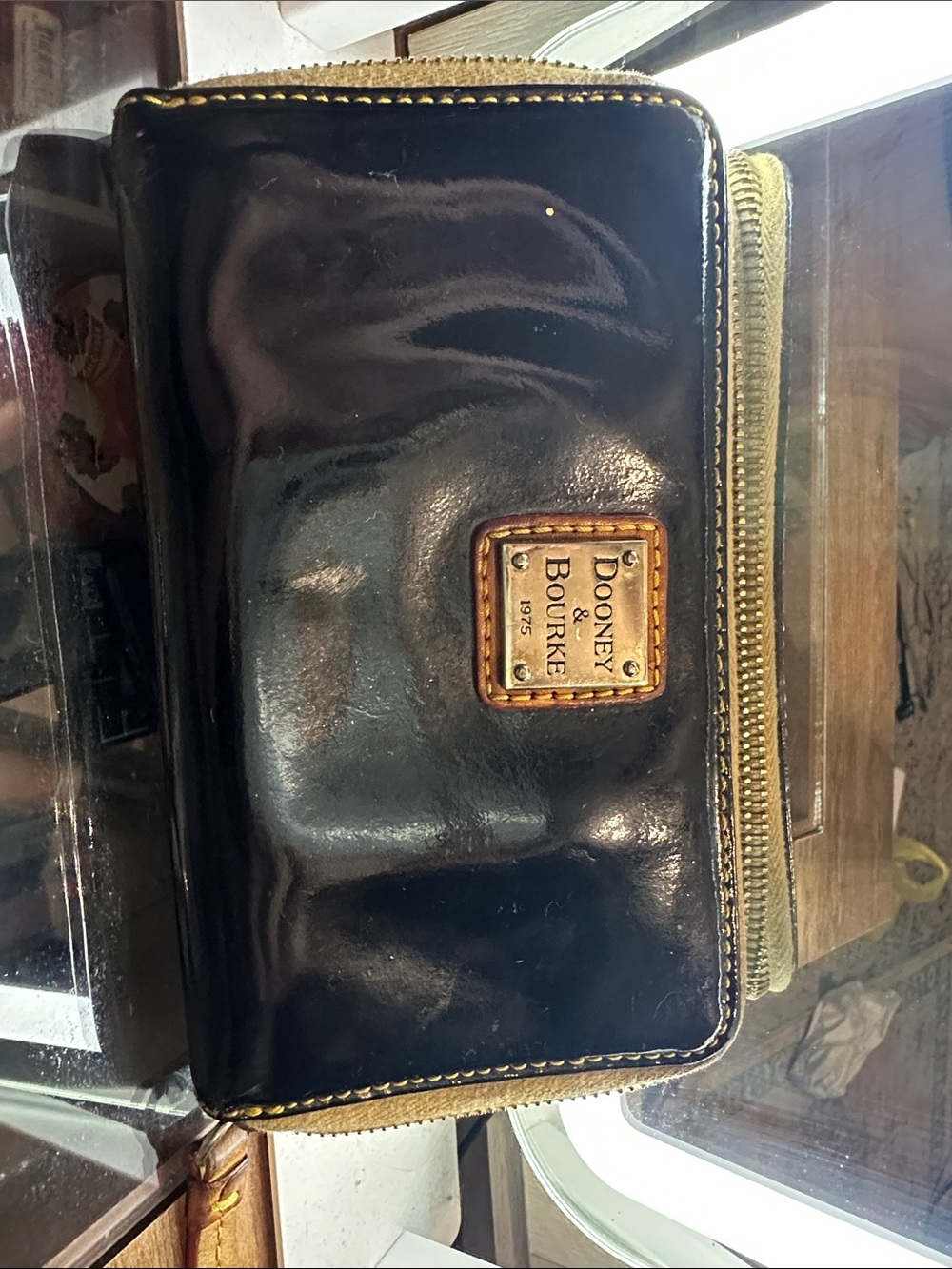 Dooney & Bourke Black Leather Wallet with Tan Trim and Gold Plate